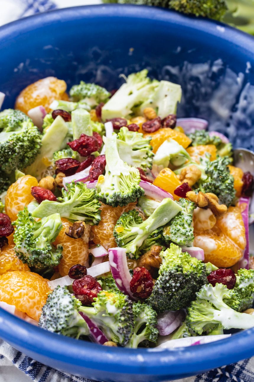 Broccoli Mandarin Salad- close-up in a blue serving bowl.