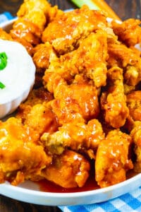 Buffalo Chicken Nuggets on a plate with Blue cheese dipping sauce.