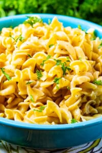 Buttered Noodles in a blue bowl.