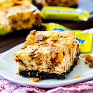 Butterfinger Cheesecake Bars on a plate.