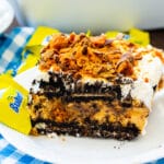 Slice of Butterfinger Oreo Icebox Pie on a plate.