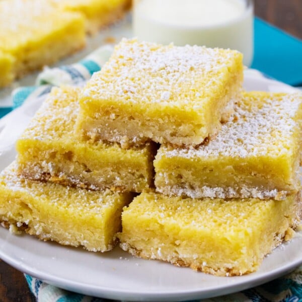 Buttermilk Chess Bars stacked on a plate.