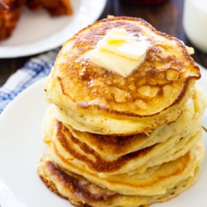 Stack of pancakes on white plate