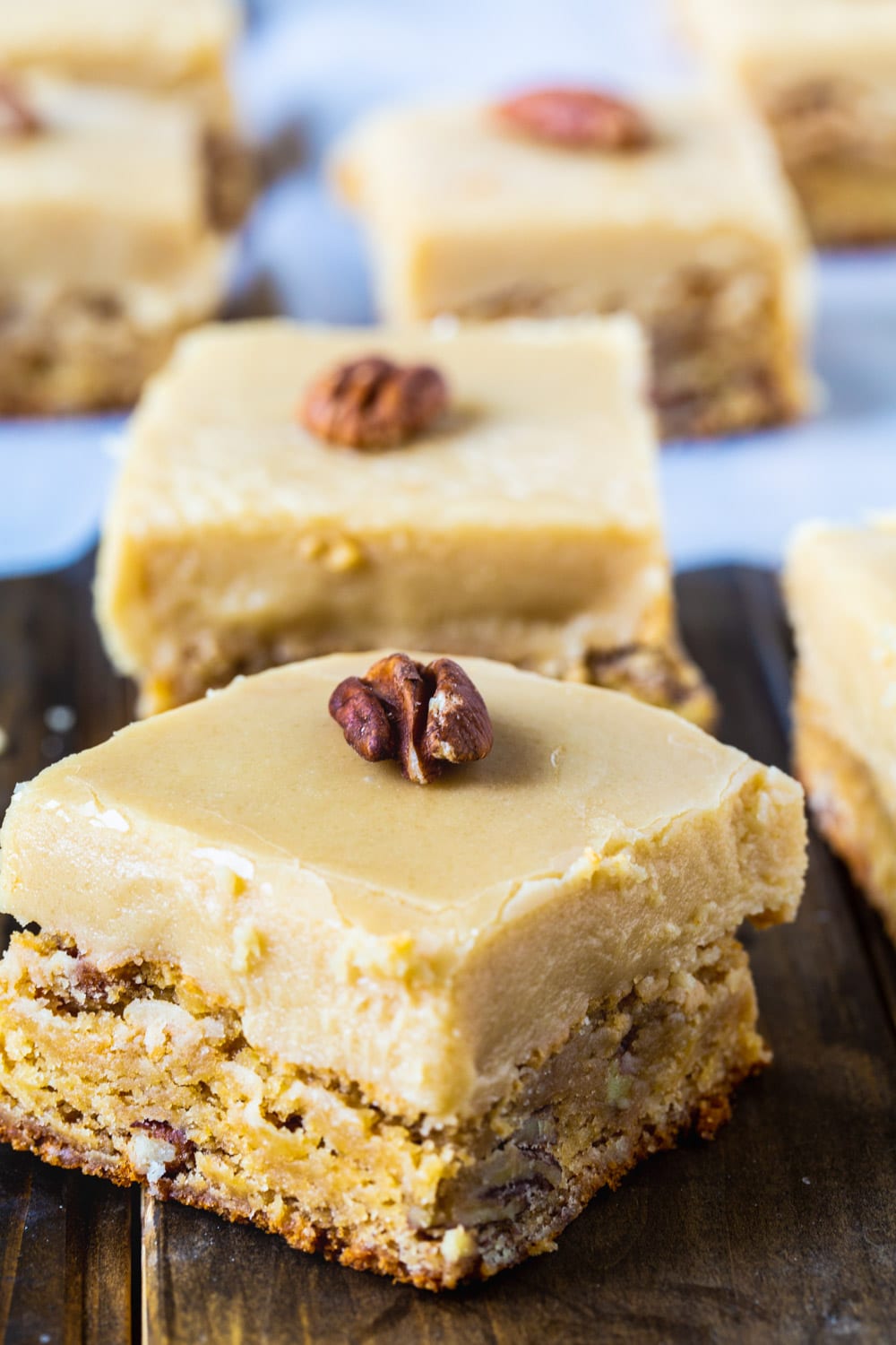 Butterscotch Blondies squares with whole pecans on top.