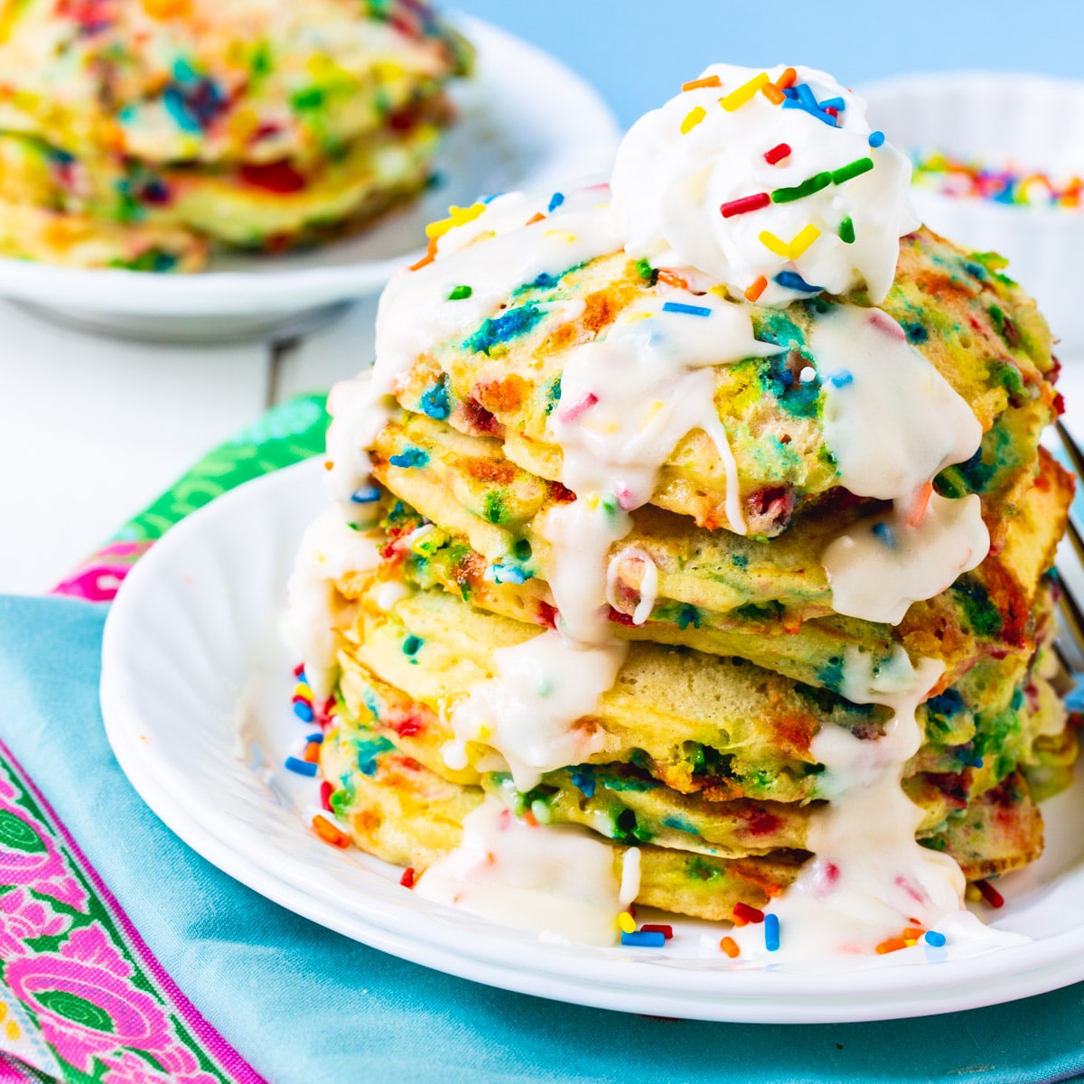 Cake Batter Pancakes stacked on a plate.