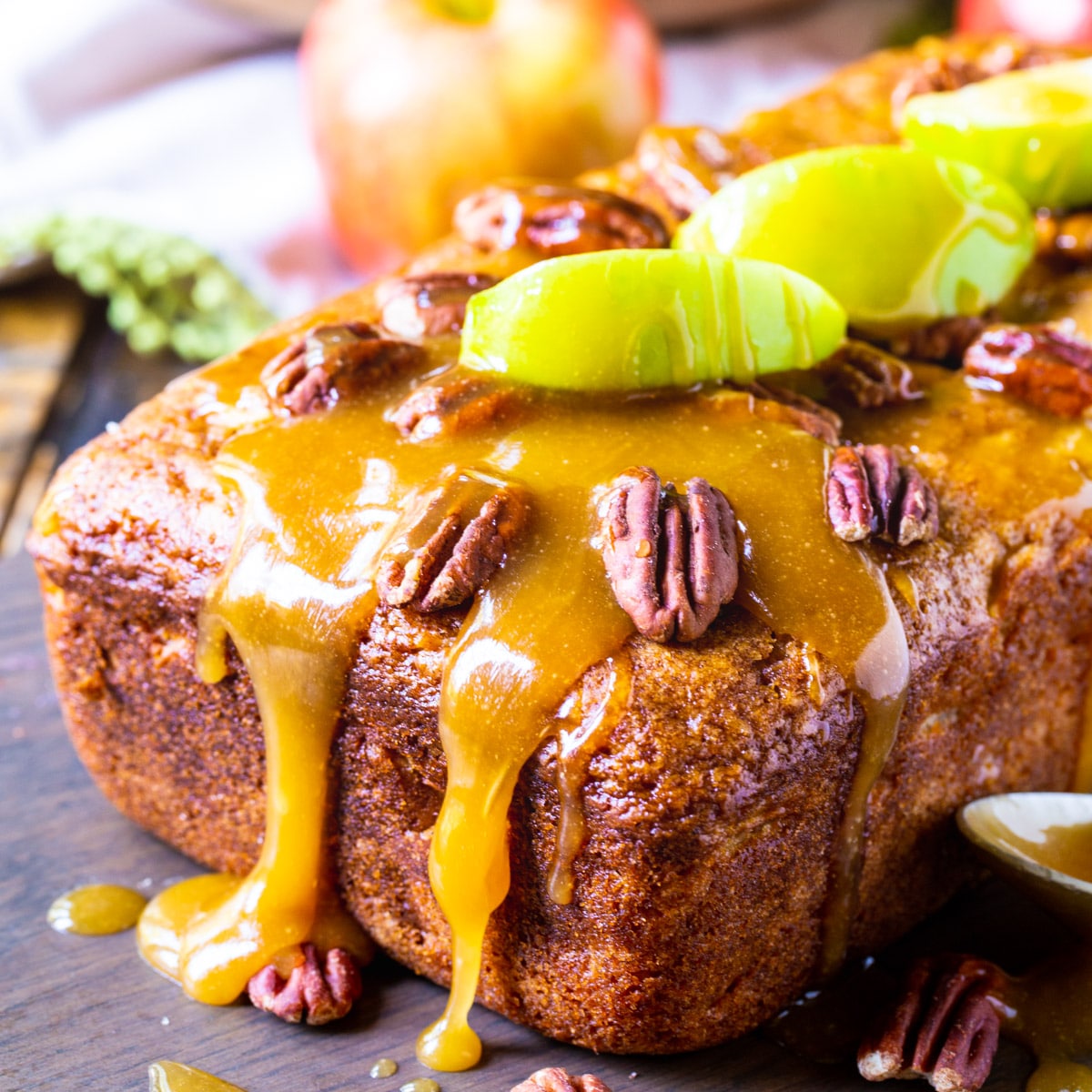 Caramel Apple Bread topped with apple slices and pecans.