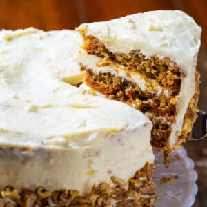 Slice of Mama Dip's CArrot Cake being lifted up.