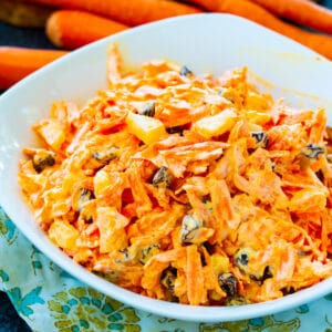 Carrot Raisin Salad in a white bowl.