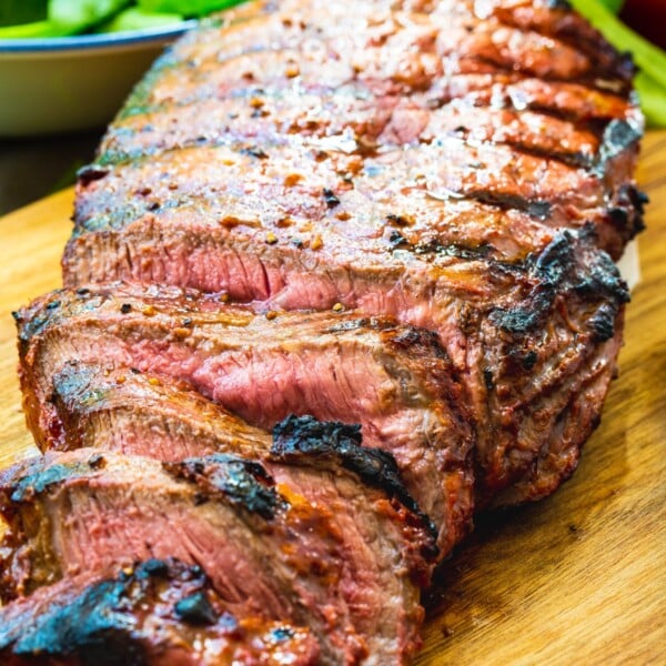 Catalina London Broil on a wood cutting board with slices cut.