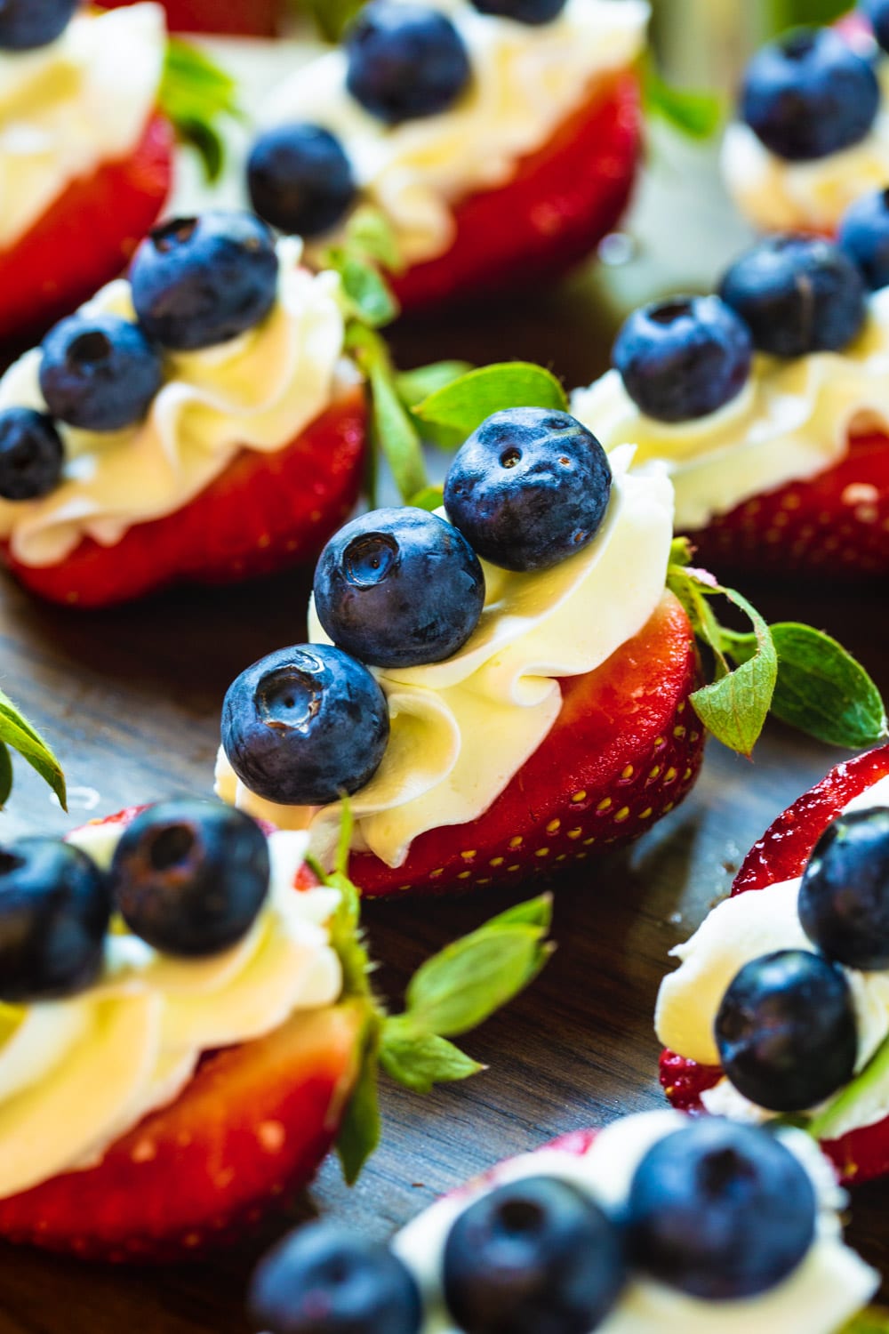 Close-Up of Red, White, and Blue Cheesecake Strawberries.