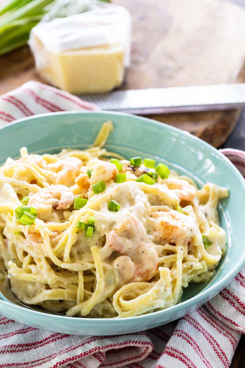 Cheesy Garlic Shrimp Alfredo in a blue bowl.