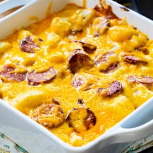 Cheesy Potatoes with Smoked Sausage in square baking dish.