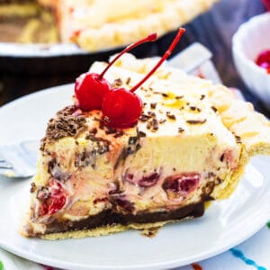 Slice of Cherry Almond Mousse Pie on a plate.