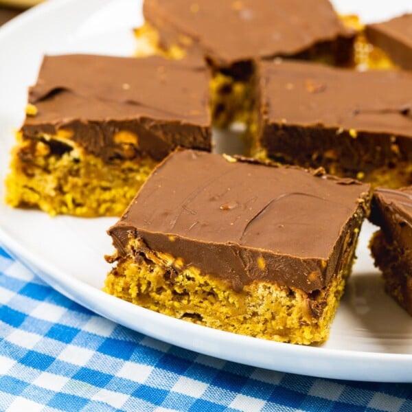 Chex Scotcharoos cut into squares on a plate.