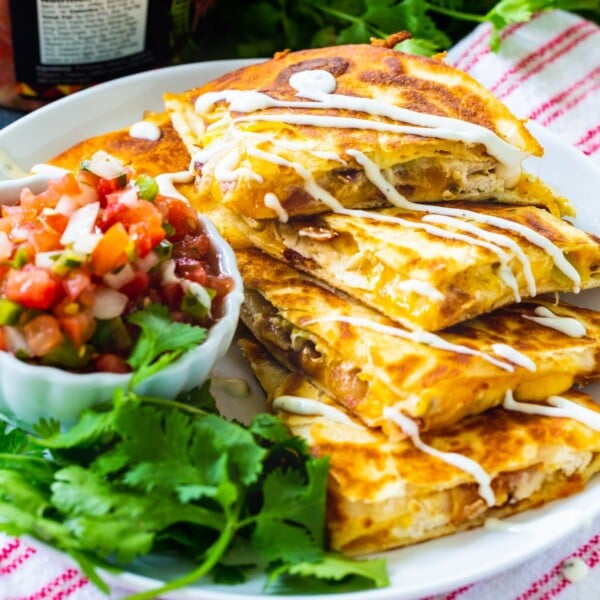 Chicken, Bacon and Ranch Quesadillas cut into triangles and stacked.