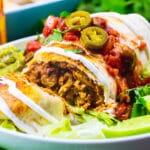 Baked Chicken Chimichanga cut open to show inside.