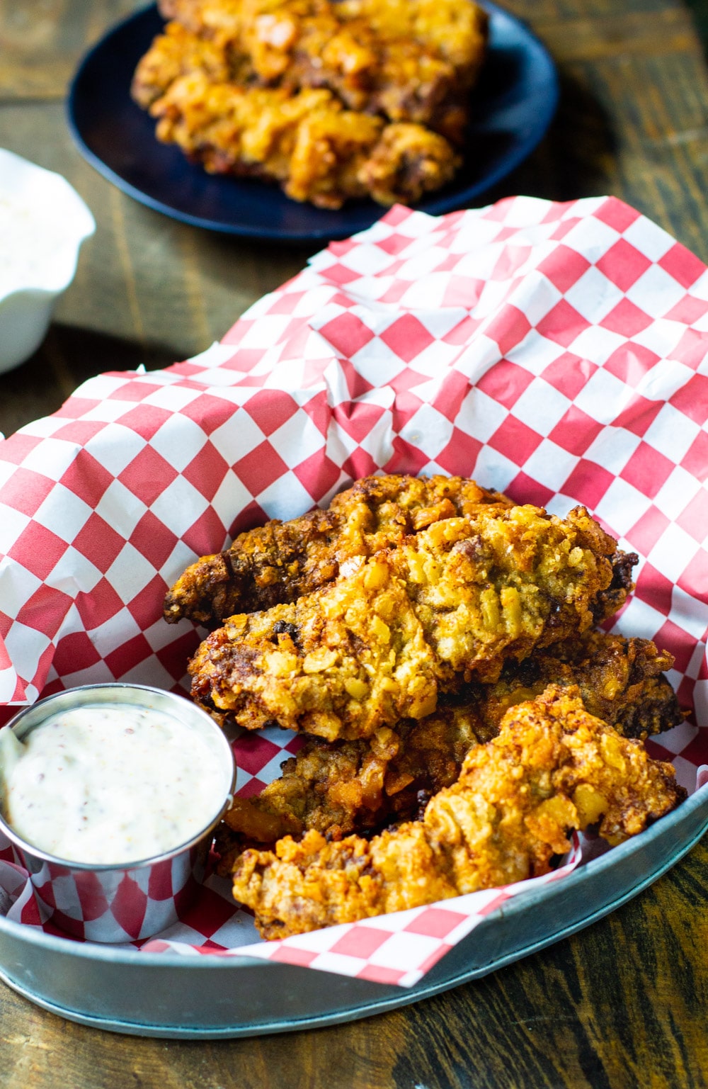 Fried Steak Fingers in a basket with Creole Mustard Sauce.