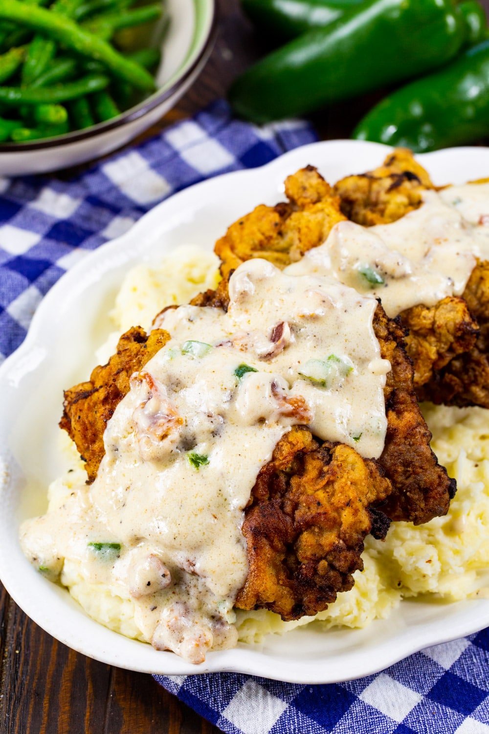 Chicken Fried Steak topped with gravy over mashed potatoes.
