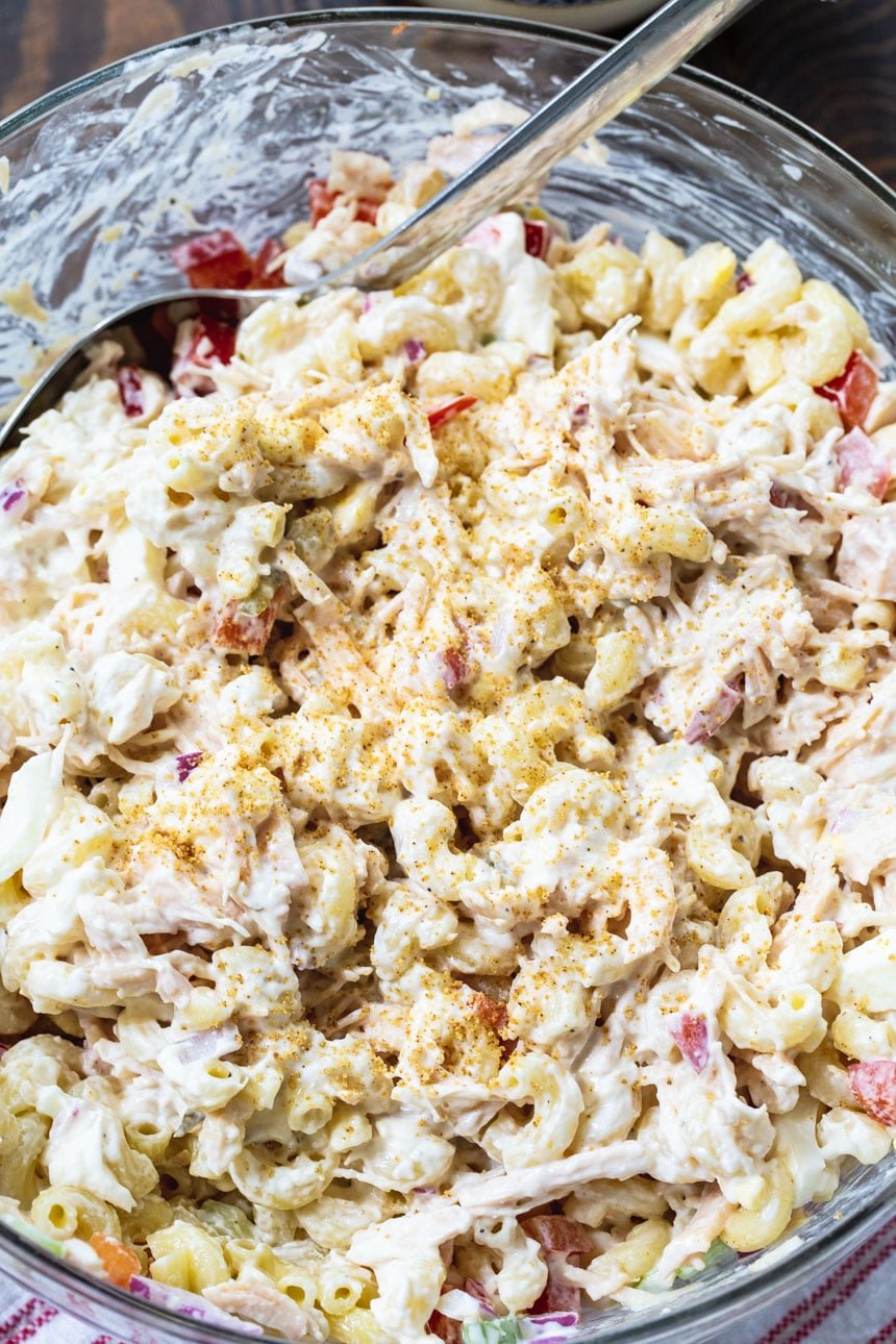 Chicken Macaroni Salad close-up in a glass serving bowl.