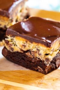 Cookie Dough Brownies on wooden cutting board.