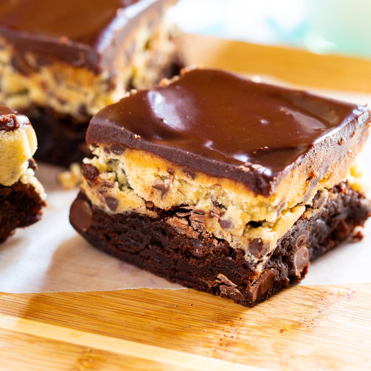 Cookie Dough Brownies on wooden cutting board.