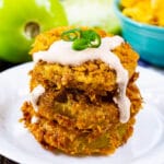 Stack of Cornflake Crusted Fried Green Tomatoes topped with Chipotle Mayo.