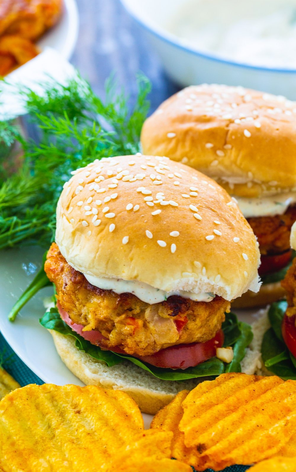 Burgers made with crawfish on a plate.