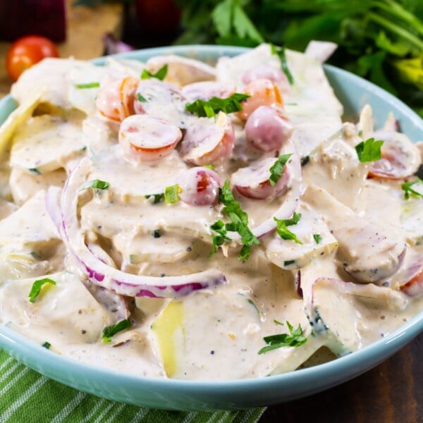 Creamy Italian Cucumber Salad in a blue bowl.