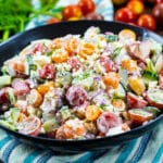 Creamy Tomato and Cucumber Chopped Salad in black bowl.