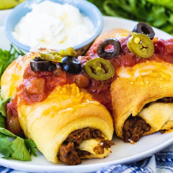 Two Crescent Burrito Bundles on a white plate.