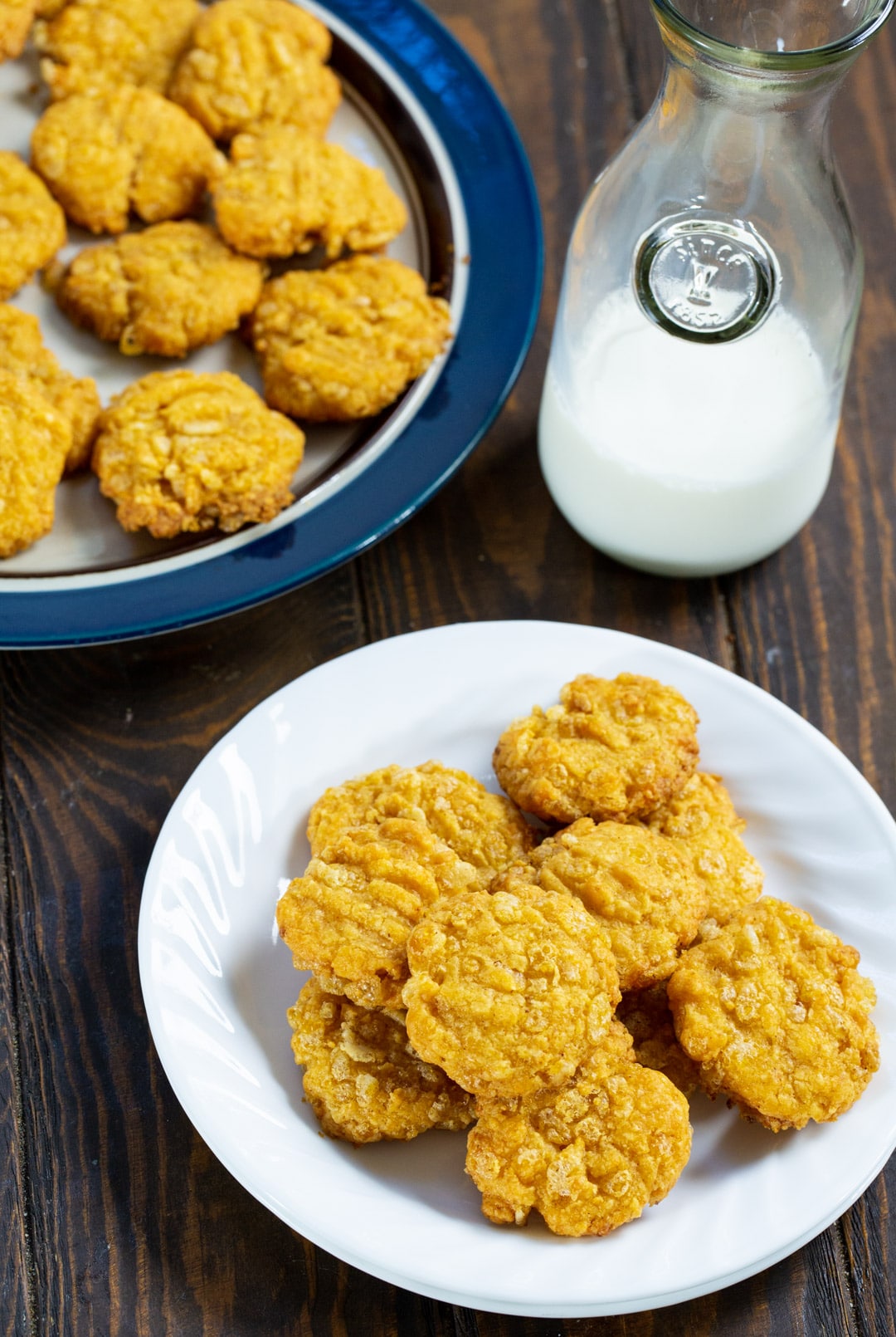 Cheese Wafers on plate and a jug of milk.