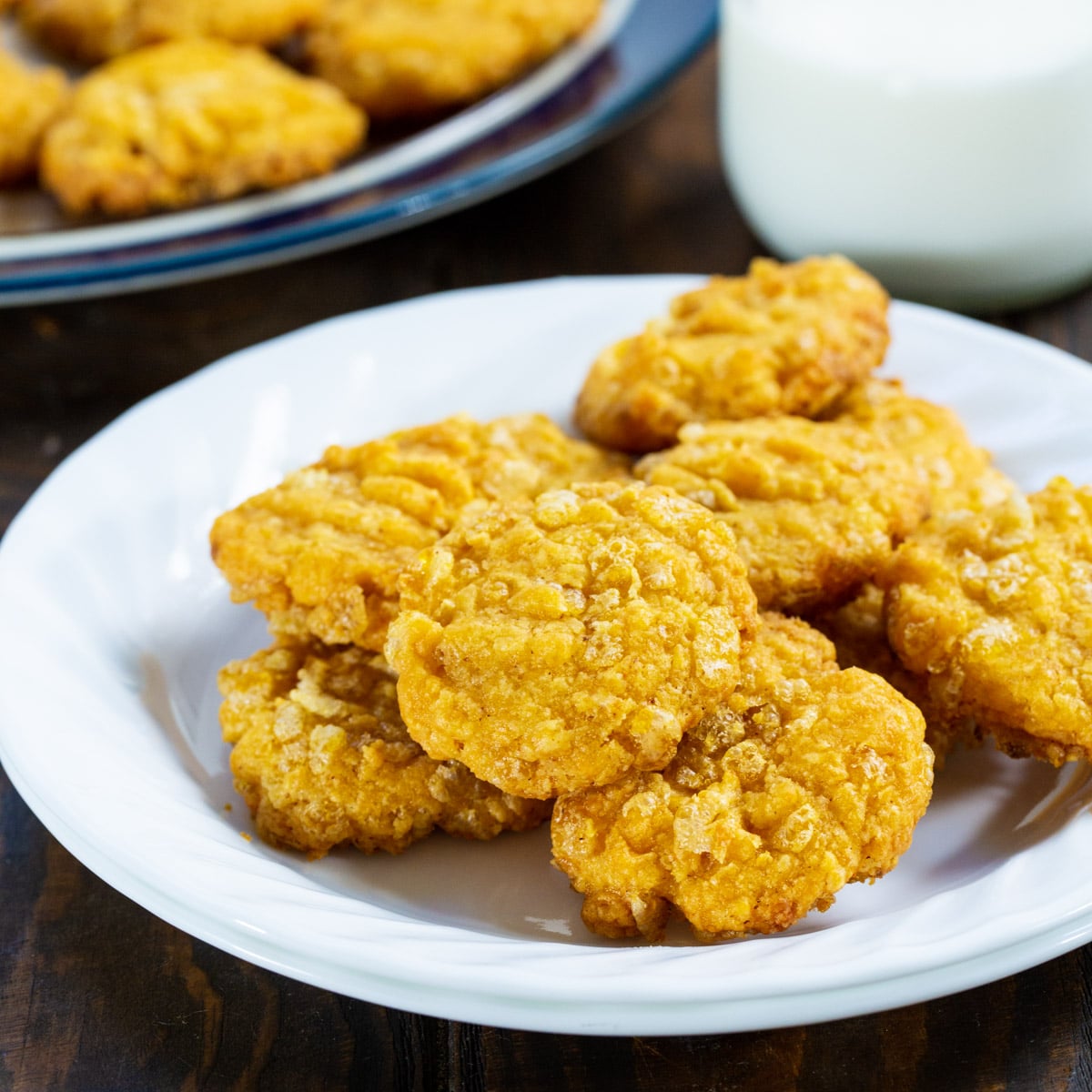 Crispy Cheese Wafers with a jug of milk.