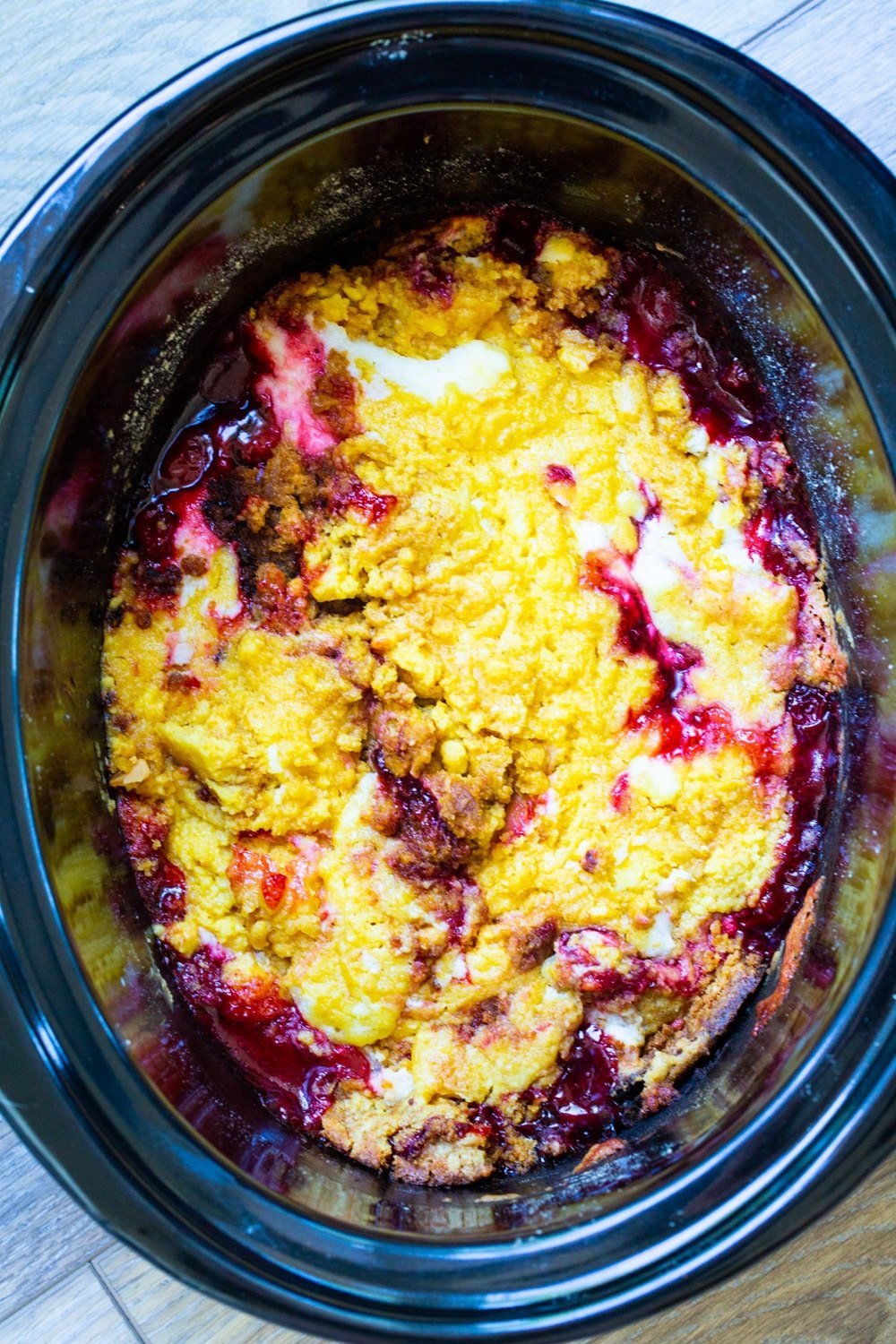 Cherries and Cream Cake in black slow cooker.