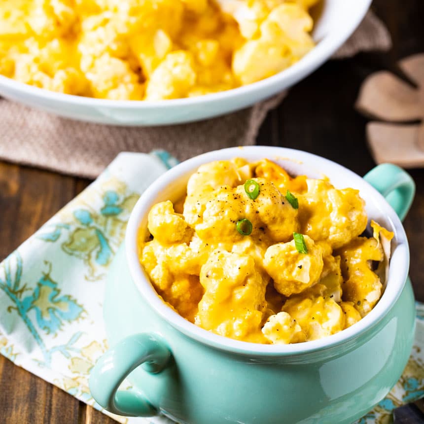 Cauliflower with Cheese in a light blue bowl.