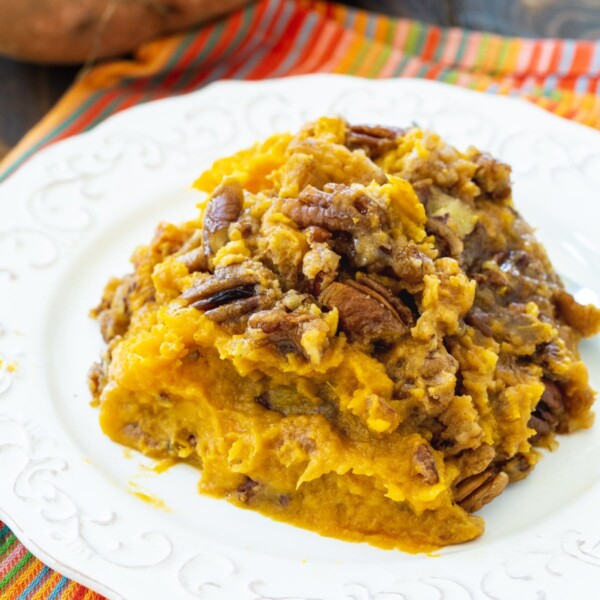 Serving of Crock Pot Sweet Potato Casserole on a plate.