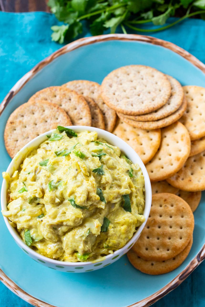 Overhead of crab dip on a plate with crackers.