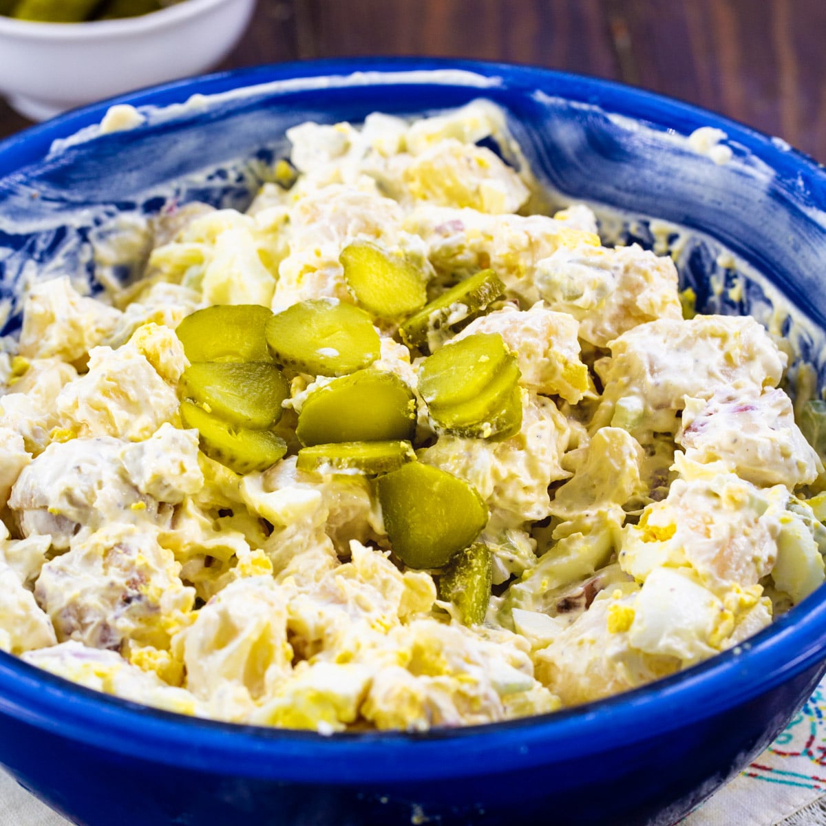 Dill Pickle Potato Salad in a blue bowl.