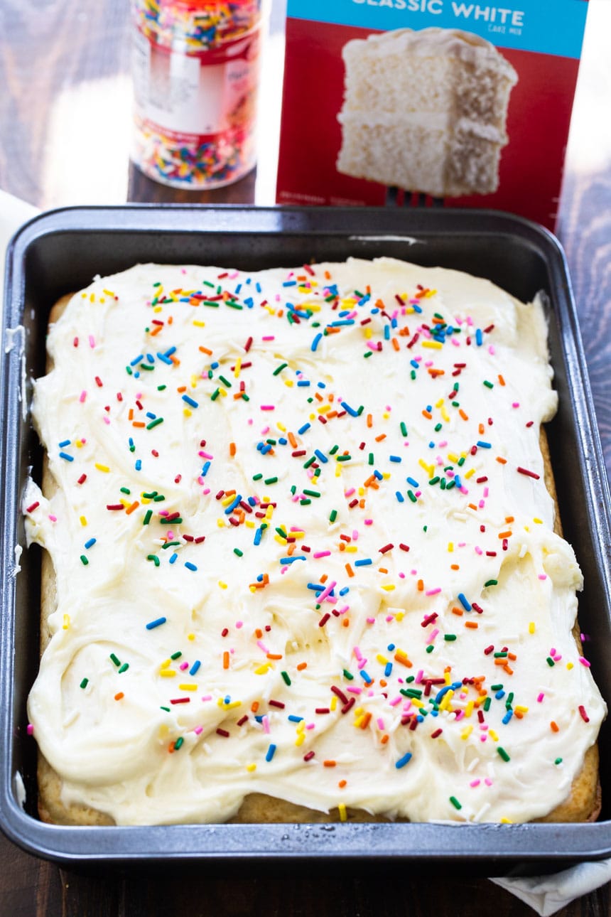 White Sheet Cake with sprinkles in a 9x13-inch baking dish.