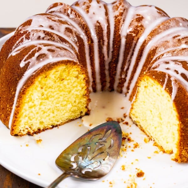 Three quarters of a Five Flavor Pound Cake on a serving platter.