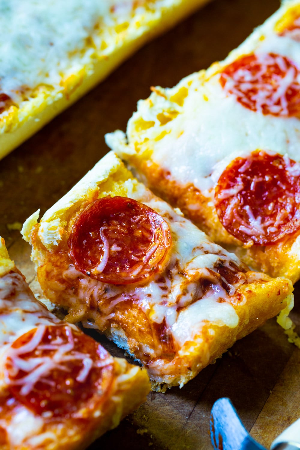 Garlic Bread Pizza cut into slices.