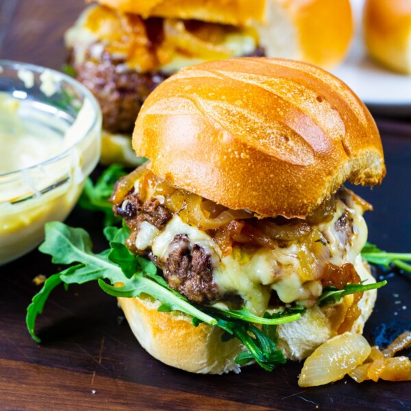 French Onion Burgers on brioche buns with arugula.