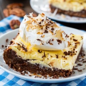 One Cheesecake Brownie on a small white plate.