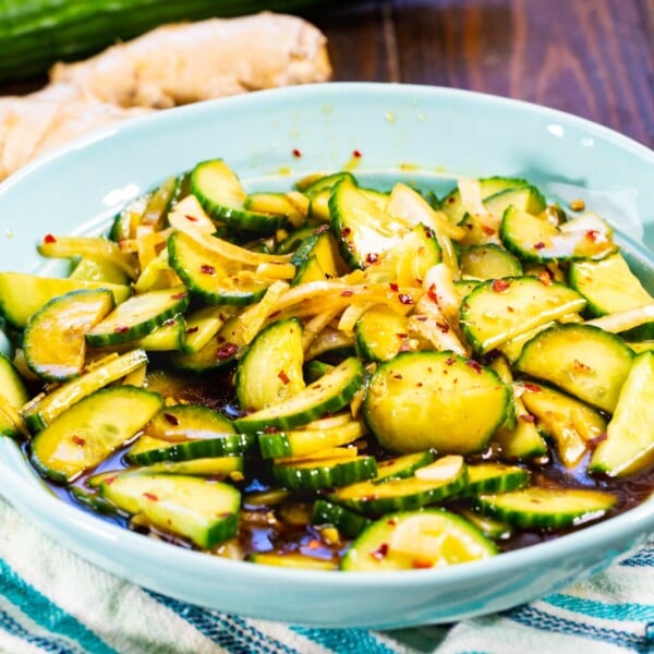 Ginger Sesame Cucumbers in a blue bowl.