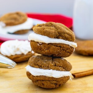 Two sandwich cookies stacked on top of each other.