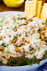 Golden Chicken Salad in a bowl with club crackers.