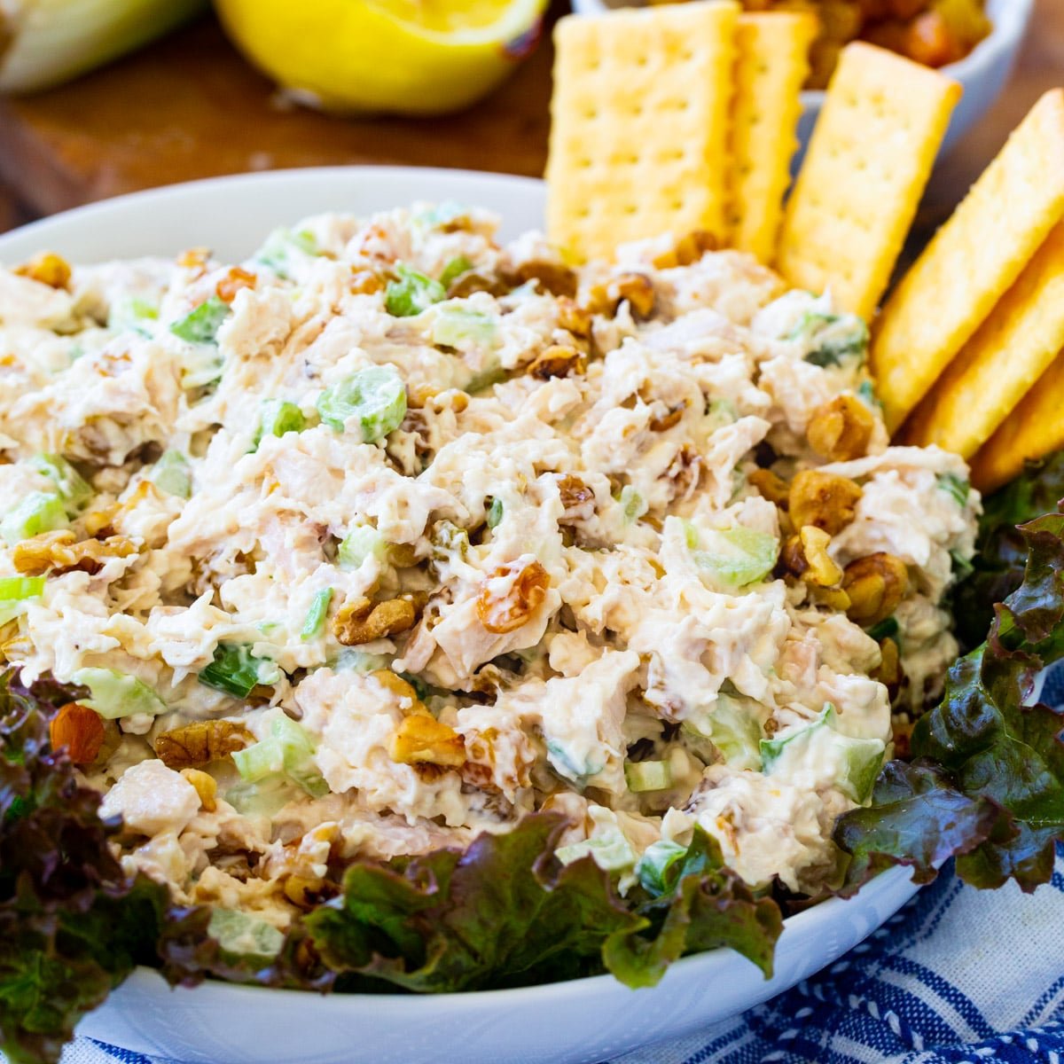 Golden Chicken Salad in a bowl with club crackers.