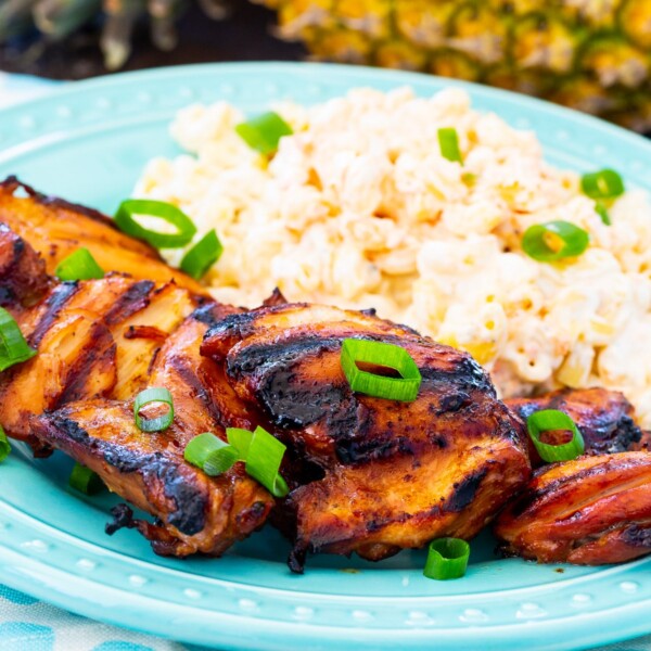 Grilled Chicken on a plate with macaroni salad.