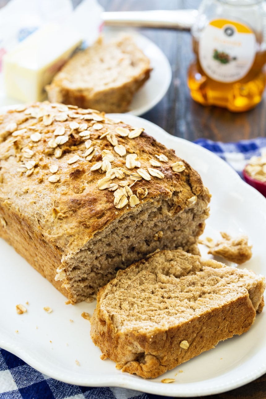Honey Oat Wheat Bread on a white serving platter.