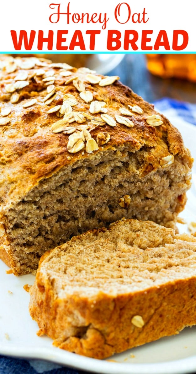 loaf of Honey Oat Bread on a white serving platter