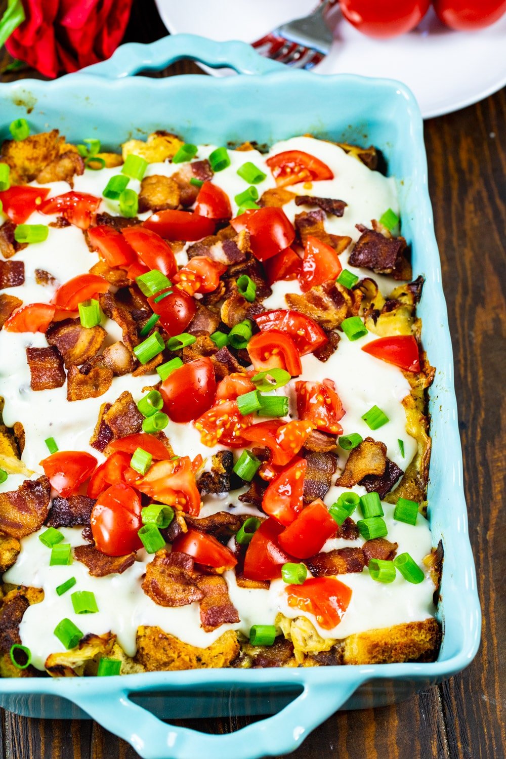 Casserole with Hot Brown Sandwich ingredients in a baking dish.